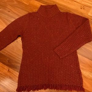 Oversized cable knit sweater with fringe